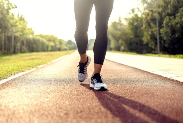 Foot and ankle treatment in progress showing hands-on regenerative therapy technique