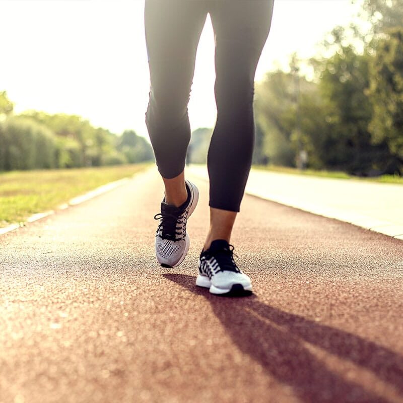 Foot and ankle treatment in progress showing hands-on regenerative therapy technique