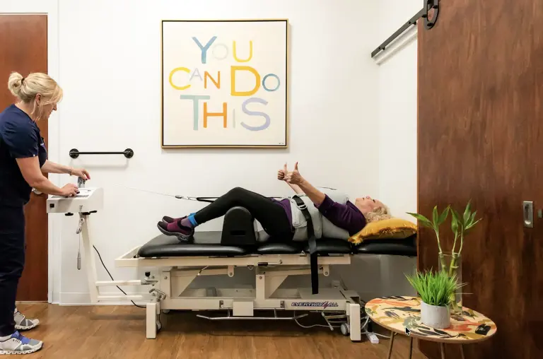 Patient receiving traction decompression therapy at Marin Joint Health